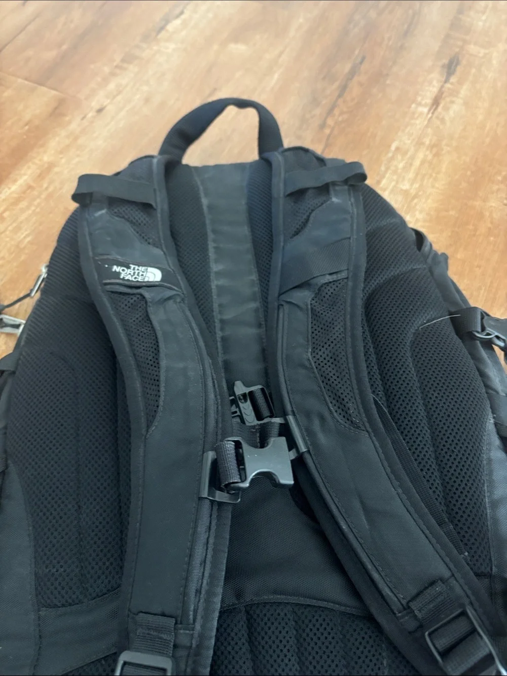 The North Face Surge Backpack in Black with Reflective Accents